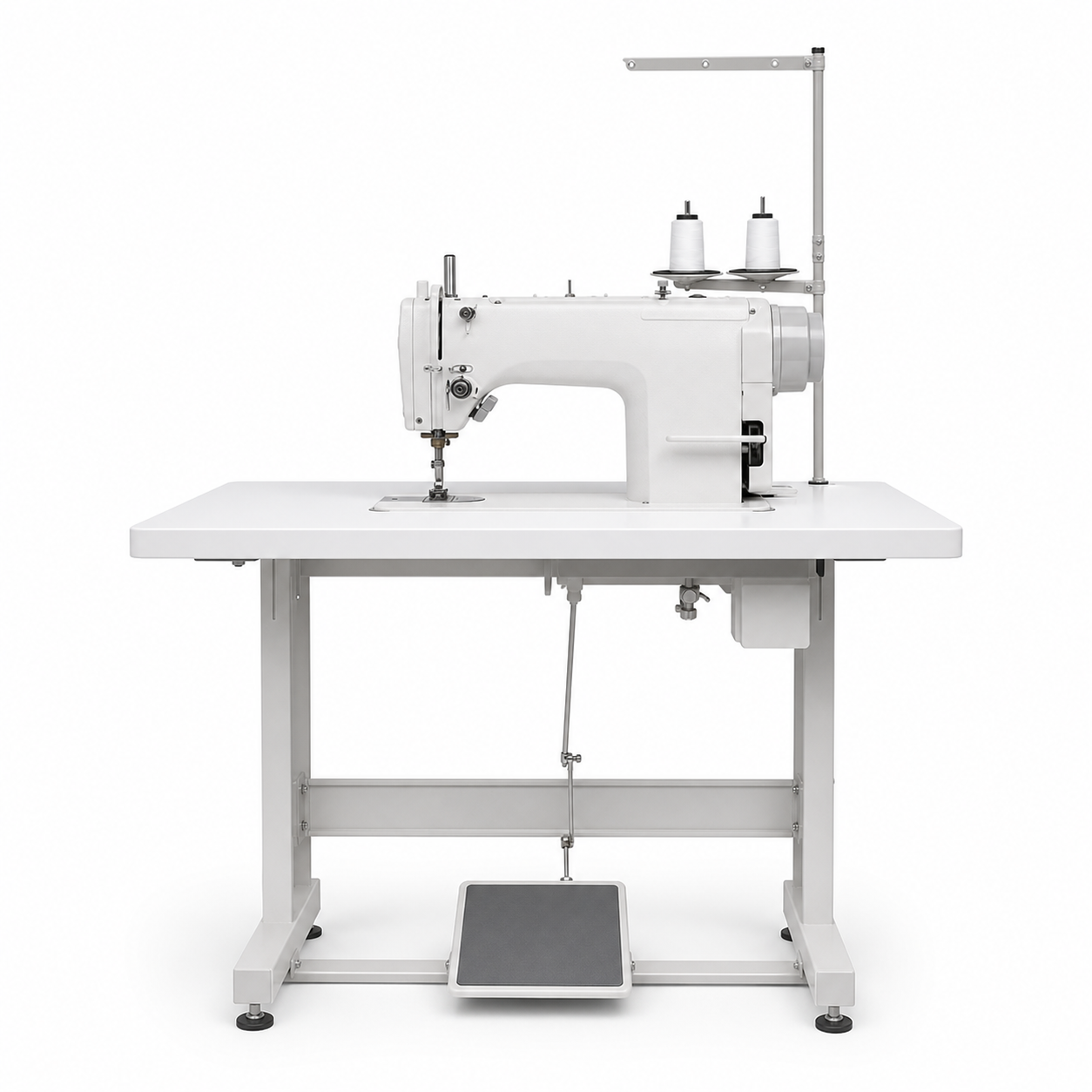 Máquina industrial sobre mesa blanca